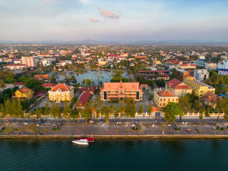 drone-view-of-buildings-and-praek-tuek-chhu-river-in-kampot-cambodia